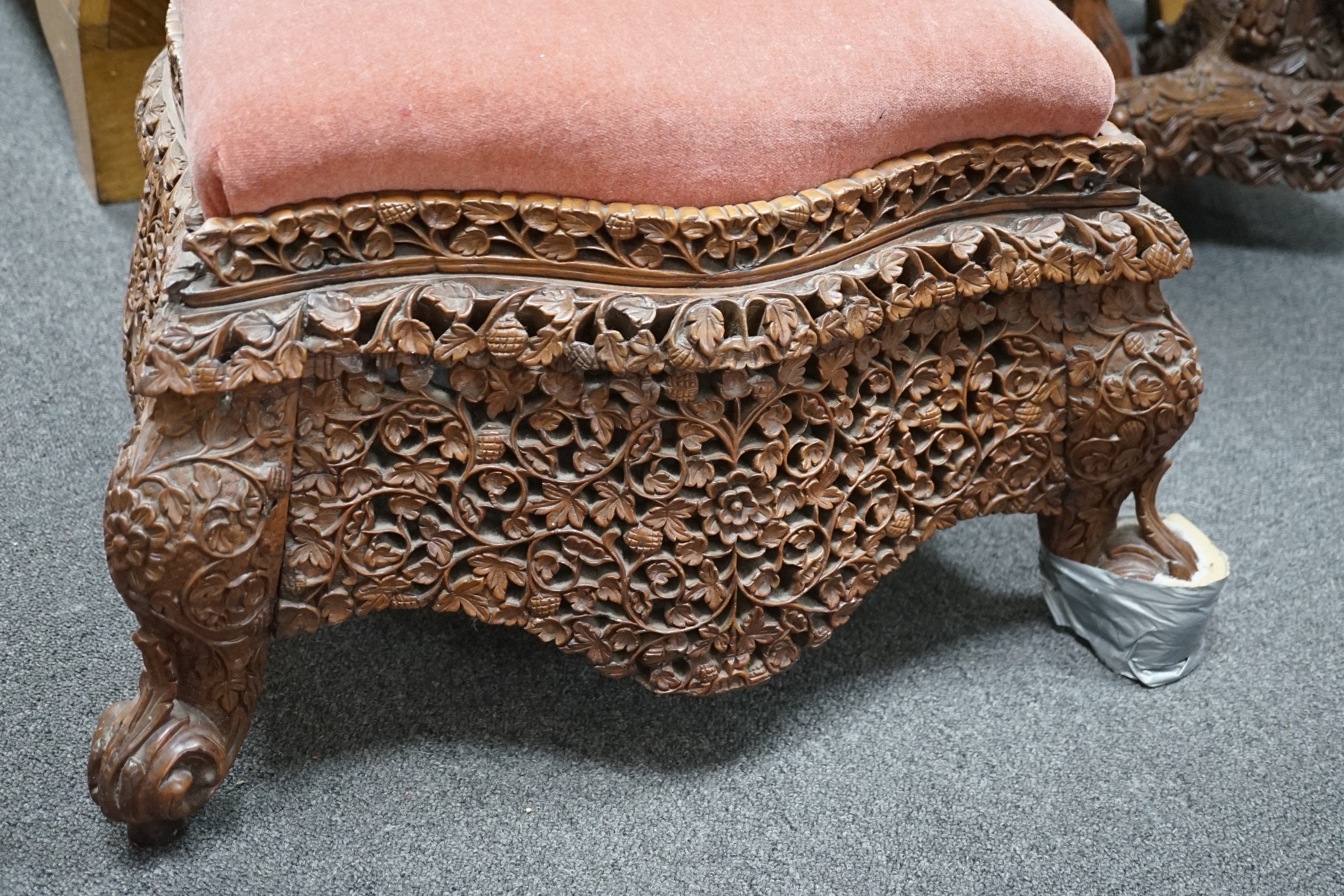 A Burmese carved hardwood circular occasional or centre table, diameter 57cm height 74cm, together with a similar side chair and foot stool